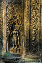 Fototapeta na wymiar ancient buddha statue at Ta Prohm, Siem Reap, Cambodia 