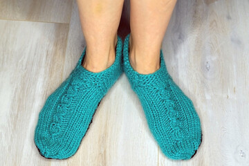 Soft photo of woman feet in cute slippers, top view point. Cozy, comfy, soft