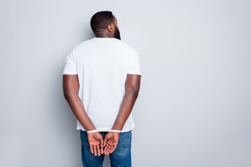 Rear behind photo of dark skin african guy criminal tied rope arms local police department freedom professional bandit loot shooting profile back closeup isolated grey color background