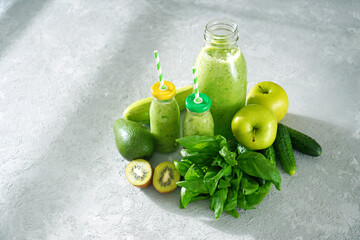 Summer green smoothie made with green fruits, vegetables and spinach