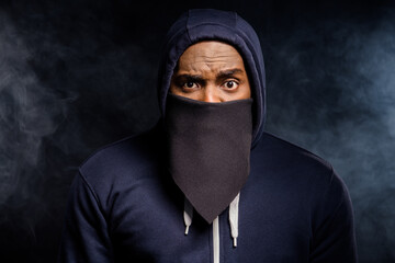 Close up photo of amazed afro american guy impressed african community discrimination ear bandanna sweater jumper isolated over black fog color background