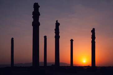 Sunset behind Silhouette of Apadana Palace Ruins in Persepolis Archeological Site of Shiraz
