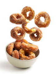 Homemade donuts flying isolated from the background