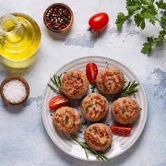 Fresh chiken cutlets with tomatoes and rosemary