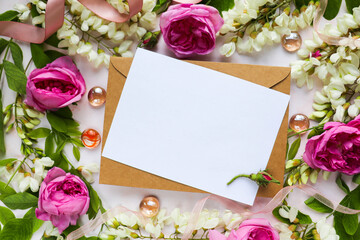 postcard mockup. greeting card. floral frame of white acacia flowers and an envelope. congratulation. invitation