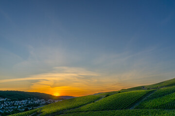 Breathtaking fire pastel sunset over the vineyards of Moselle river valley in Germany in Bernkastel-Kues 