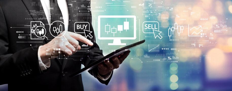 Stock trading theme with businessman using his tablet computer