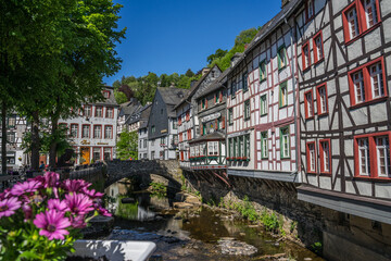 Monschau town in Germany street view with half-timbered houses and Rur river - a small resort town in the Eifel region of western Germany, located in the Aachen district of North Rhine-Westphalia 