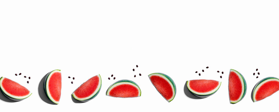 Sliced watermelons arranged on a white background