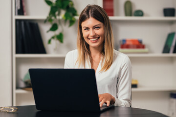  beautiful caucasian blond girl student professional standing at home in office looking at camera, happy confident entrepreneur  laughing face posing alone, head shot close up view portrait
