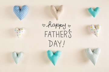Father's Day message with blue heart cushions on a white paper background