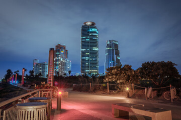 Fototapeta na wymiar Skyscrapers hotels in Miami Beach at night. Miami South Beach, Florida. View from South Pointe Park Pier