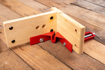 Joining wood using a carpentry clamp. Small carpentry work.