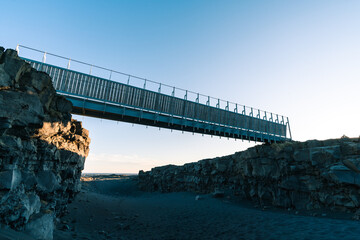 Bridge Between Continents is located in Reykjanes peninsula easily accessible from Reykjavik the capital town of Iceland. Tourism in Iceland. High quality photo during golden hour