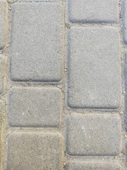 Gray background, texture of rectangular bricks with putty.