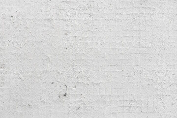 abstract background of an old tiled wall painted white