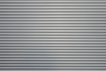abstract background of an embossed grey plastic surface close up