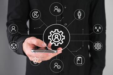 Setting icon, network concept, man with a phone in his hands.