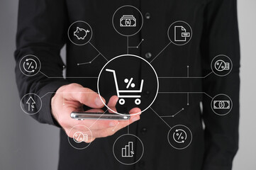 Shopping cart, online shopping, man with a phone in his hands