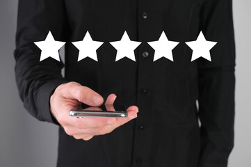 Business man giving a five star rate, leave positive feedback.