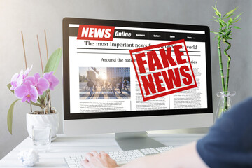 Man read fake news on a computer screen. Mockup website. Newspaper and portal on internet. concept...