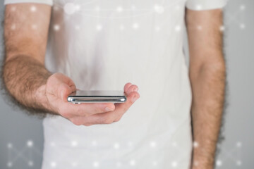 Man with a phone, browsing the internet, networking concept.