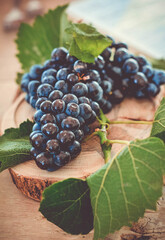 Grapes on a wooden serving plate.