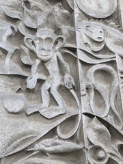 stone relief with monkey on the wall