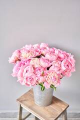 Pink Angel Cheeks peonies in a metal vase. Beautiful peony flower for catalog or online store. Floral shop concept . Beautiful fresh cut bouquet. Flowers delivery