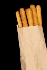 Crispy breadsticks, grissini on dark background