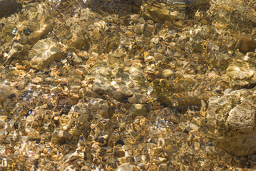 Small stones under the water surface