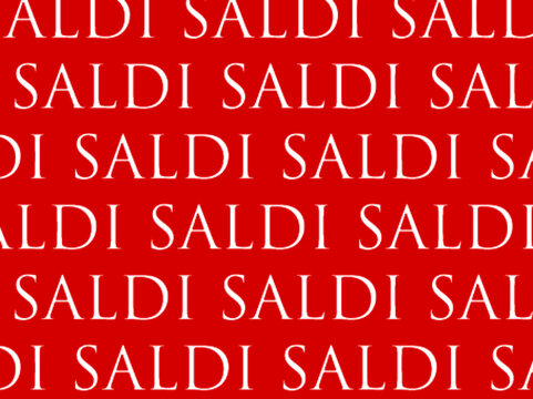 scritta saldi in bianco su sfondo rosso