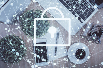Double exposure of lock drawing over desktop. Top view. Security concept.