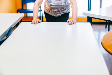 Move and adapt tables in a school academy so that students maintain a safe distance.