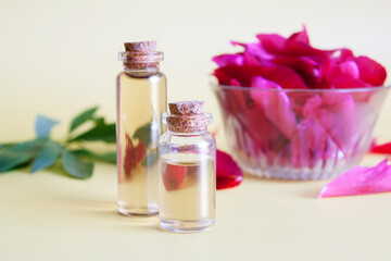Glass bottles with essence from flower petals. Natural cosmetics concept