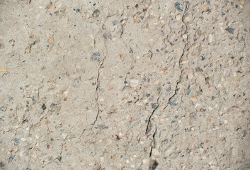 Cracked concrete top view texture background. Damaged gray concrete footpath