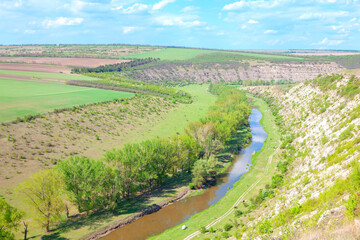 Fototapeta na wymiar river among hills , aerial view of nature reserve 