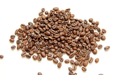 coffee beans are scattered on a white background