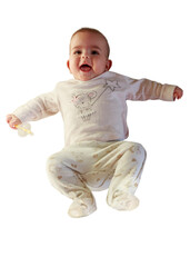 Cute small white skin with brown hair five months baby on white background isolated looking up with funny smile on face, little child with big eyes, innocent girl, happy smiling laughing kid