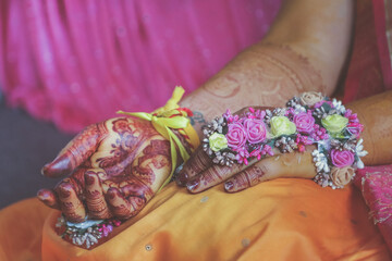 Indian Hindu Pre wedding Haldi ceremony hands and feet decorations close up