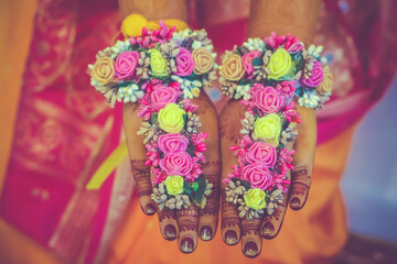 Indian Hindu Pre wedding Haldi ceremony hands and feet decorations close up