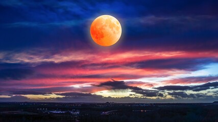 Eclipse of the moon in clouds sky, natural phenomenon