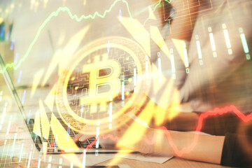 Double exposure of woman hands typing on computer and crypto market theme hologram drawing. Blockchain concept.