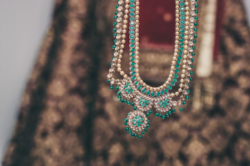 Indian Hindu bride's wedding jewellery, necklace, ear rings close up