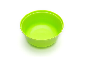 Green bowl for fruits and vegetables on a white background