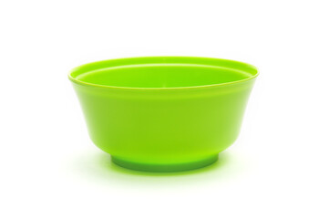 Green bowl for fruits and vegetables on a white background