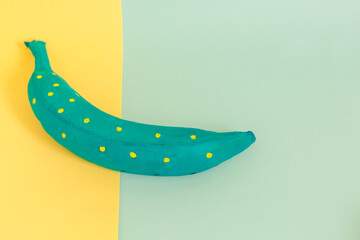 banana in pink couple with blue and white on a yellow and blue background, conceptual, artistic