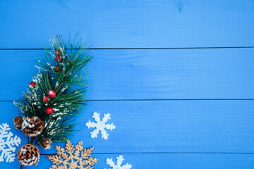 blue wooden background with christmas decoration