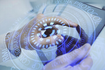 Multi exposure of man's hand holding and using a digital device and data theme drawing. Innovation...