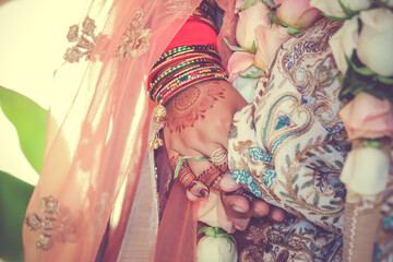 Indian Hindu wedding ceremony ritual items hands close up